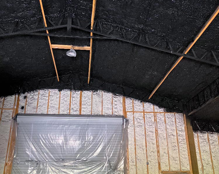 Ceiling and walls with finished spray foam insulation inside a building