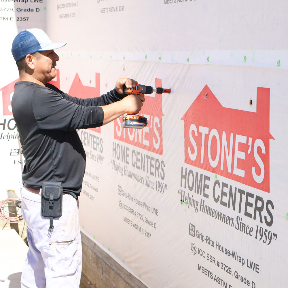 professional preparing for injection foam insulation