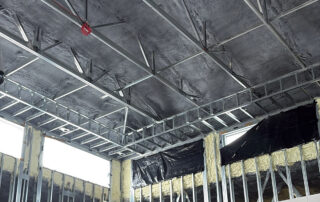 Open-cell spray foam insulation installed on the high ceiling of the Wakulla Library commercial construction project.