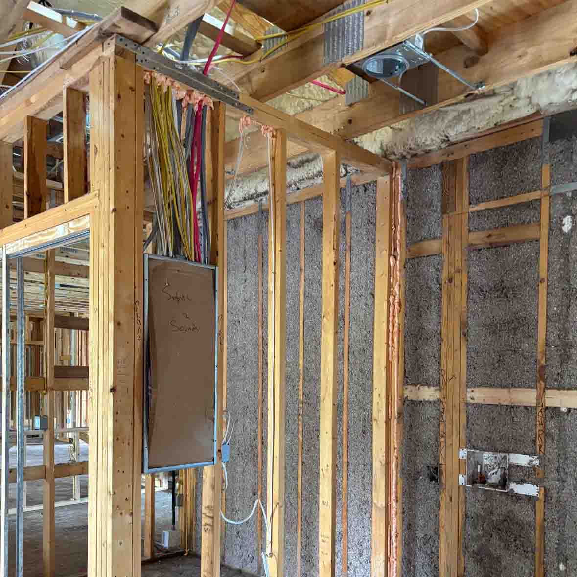 Quality Insulation of Valdosta sprayed R-19 cellulose into exterior wall cavities near an electrical panel, with R-21 open-cell spray foam in the attic, in Pinetta, FL.