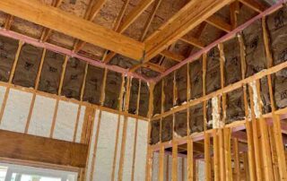 Johns Manville Spider Plus in exterior wall cavities with kraft-faced batts in the upper walls of a new home.
