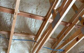 Quality Insulation of Valdosta sprayed R-21 open-cell foam on the roof deck between attic trusses, above walls filled with R-19 cellulose, in Pinetta, FL.