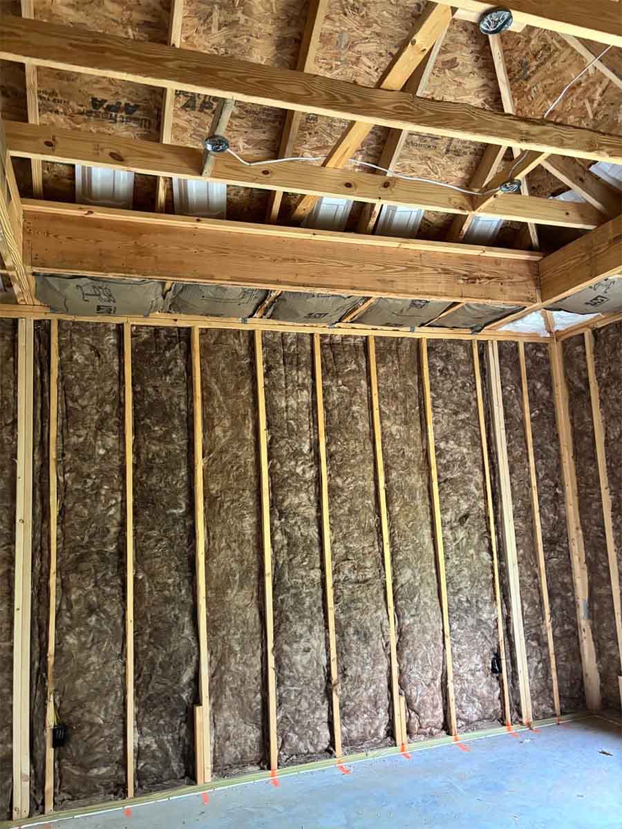 Quality Insulation of Valdosta installed fiberglass batts in wall stud cavities from slab to ceiling beam in a new home in Hahira, GA.